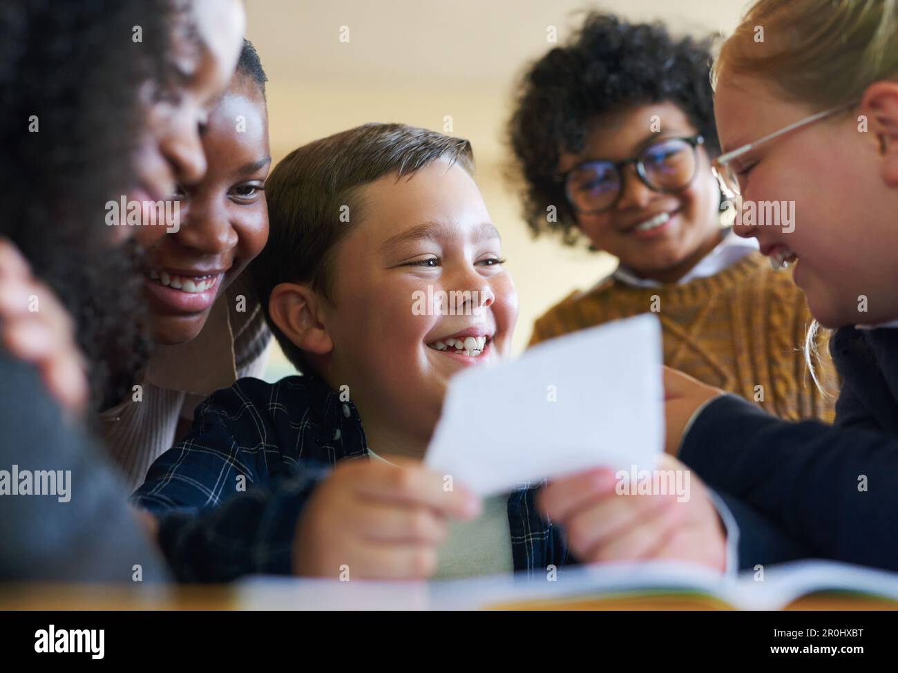 Huddled Notes What do I say to this note. a diverse group of children huddled ...