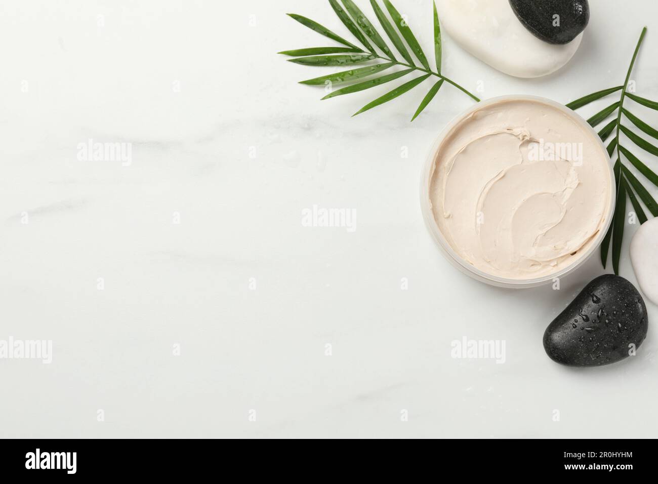 Flat lay composition with different spa products on white marble table ...