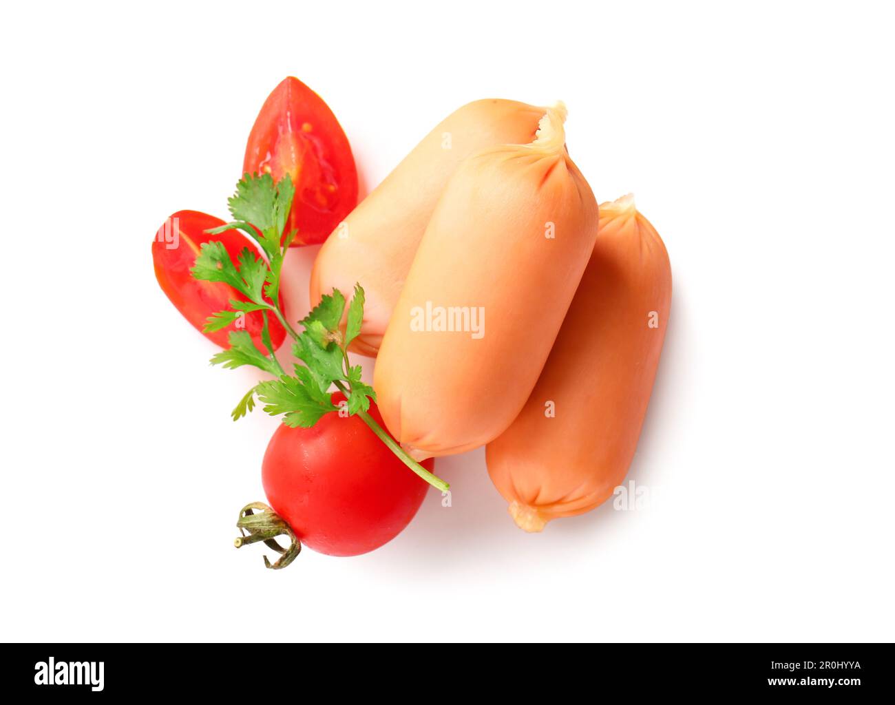 Tasty boiled sausages with parsley and tomato on white background Stock Photo