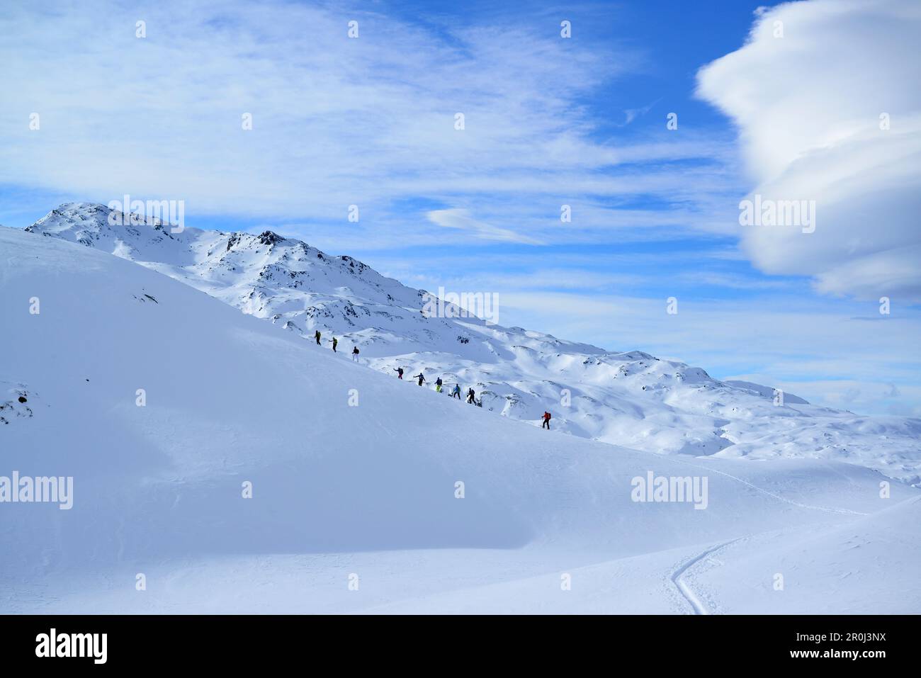 Back-country skiers ascending to Regenfeldjoch, Langer Grund, Kitzbuehel Alps, Tyrol, Austria Stock Photo