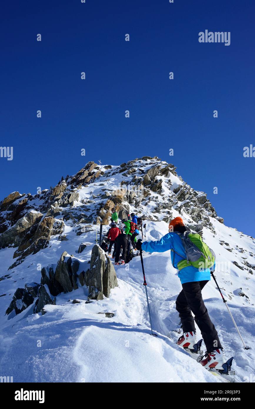 Back-country skiers ascending to Kuhscheibe, Stubai Alps, Tyrol, Austria Stock Photo
