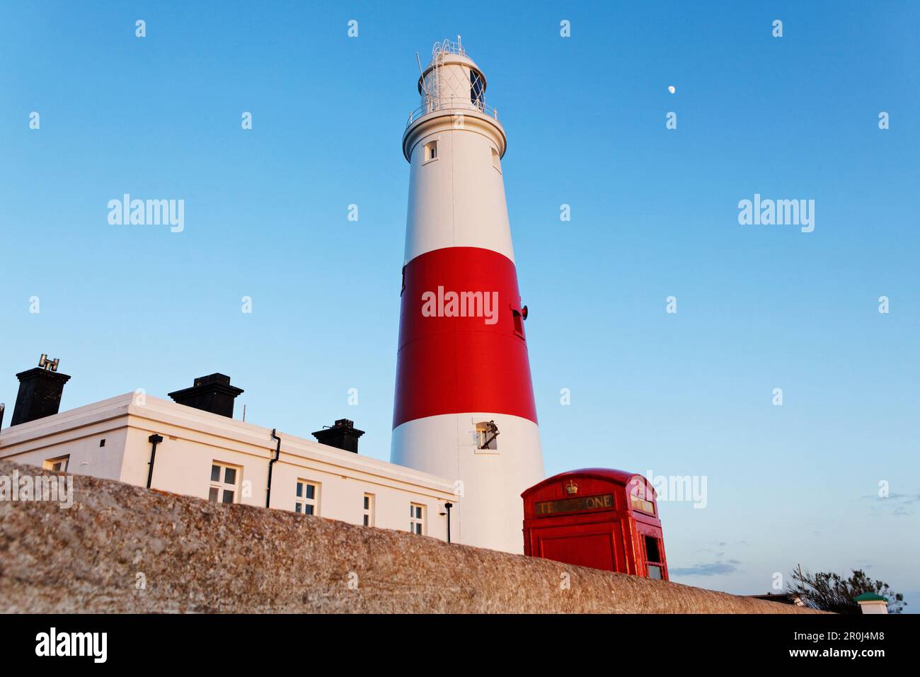 Portland Bill Lighthouse and typical red phone booth, Weymouth ...