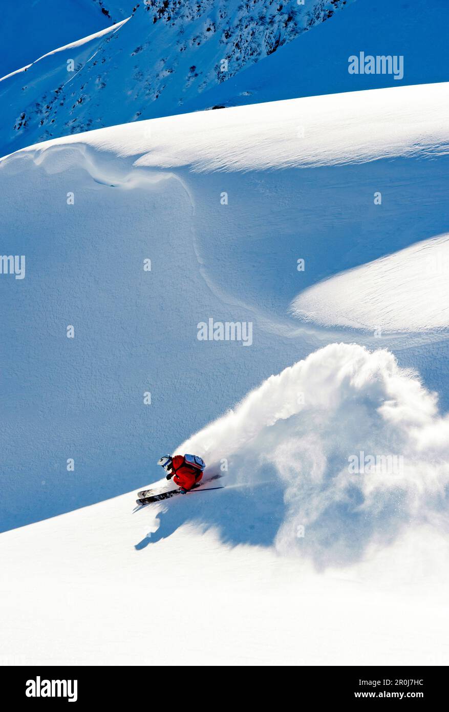 Skier doing a nice turn with lots of powder snow, Gargellen, Vorarlberg, Austria Stock Photo