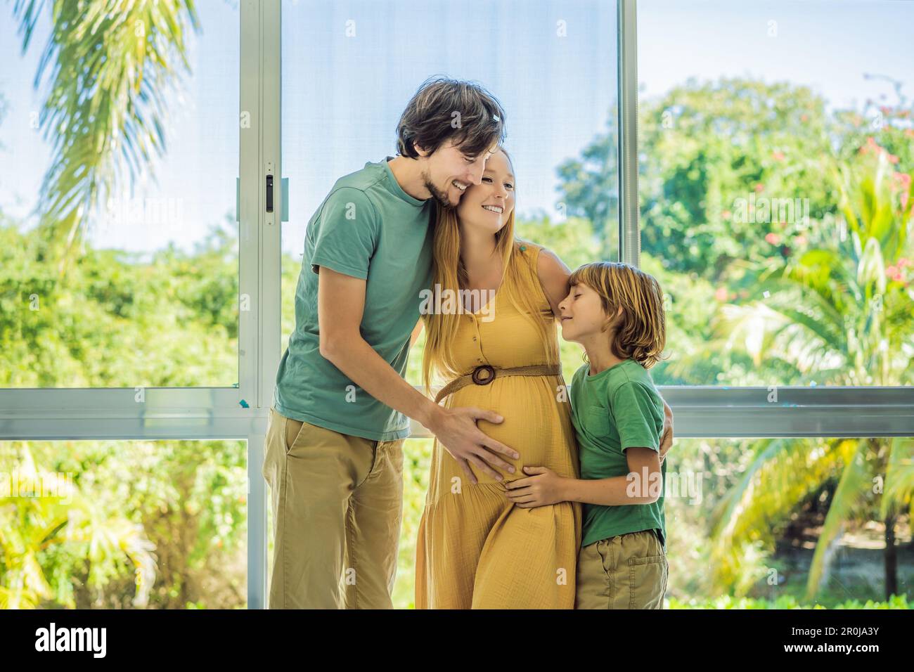 It's a boy. Expectant parents mother, father and their elder son are ...