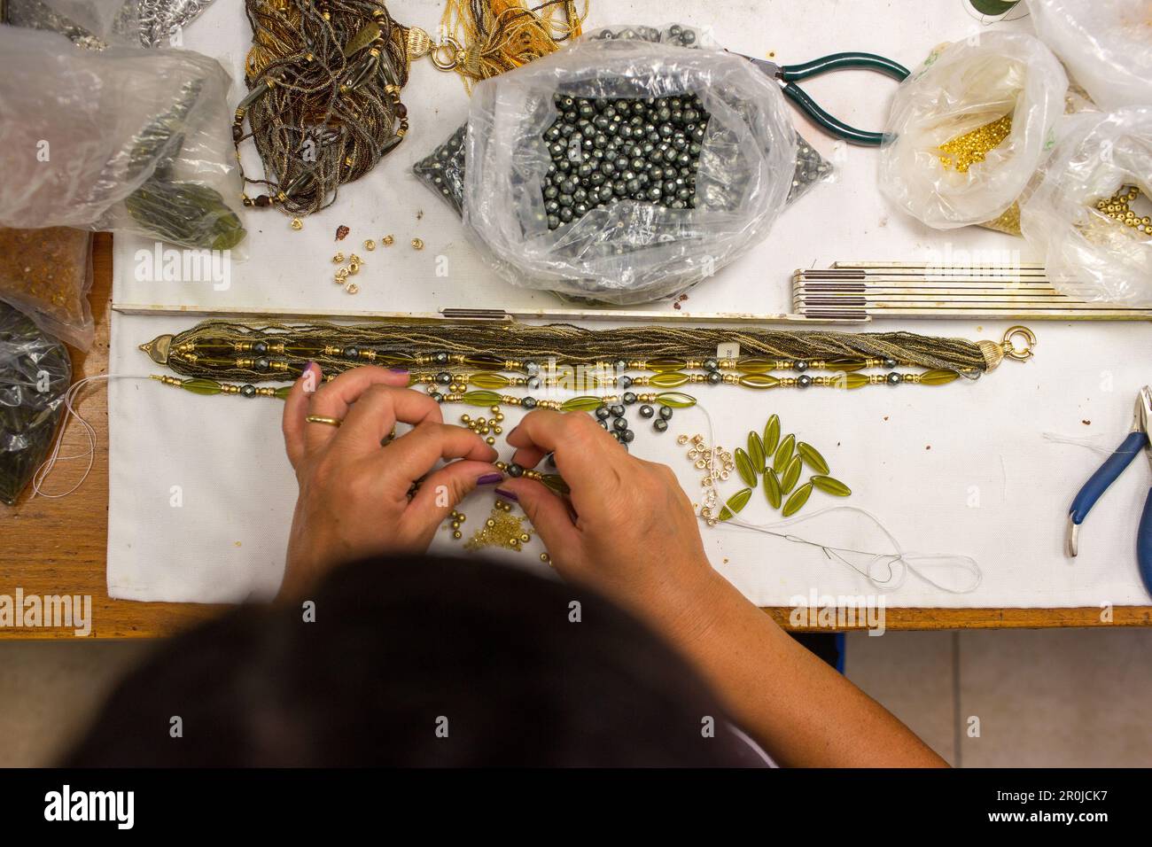 glass bead artists at Atelier Gioia of Luisa Conventi, threading beads