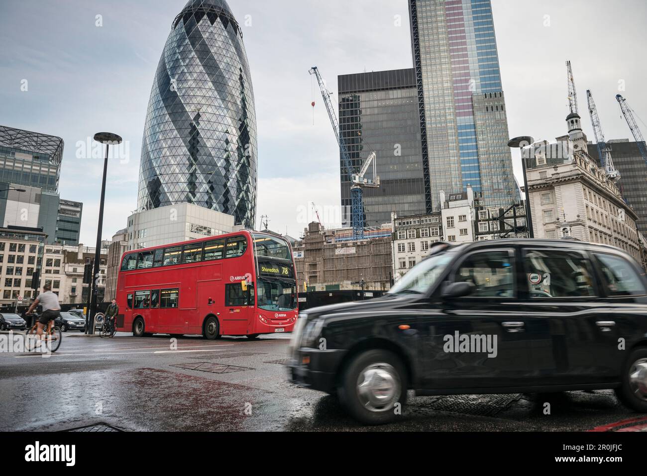 'the Gherkin' by Norman Foster with typical London cab and red bus, Liverpool Street, City of London, England, United Kingdom, Europe Stock Photo