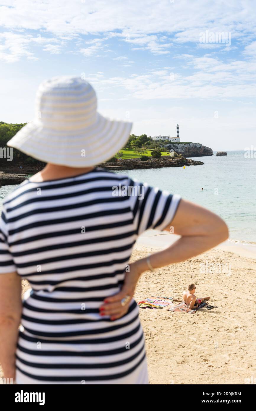 Woman on beach looking towards hi-res stock photography and images - Alamy