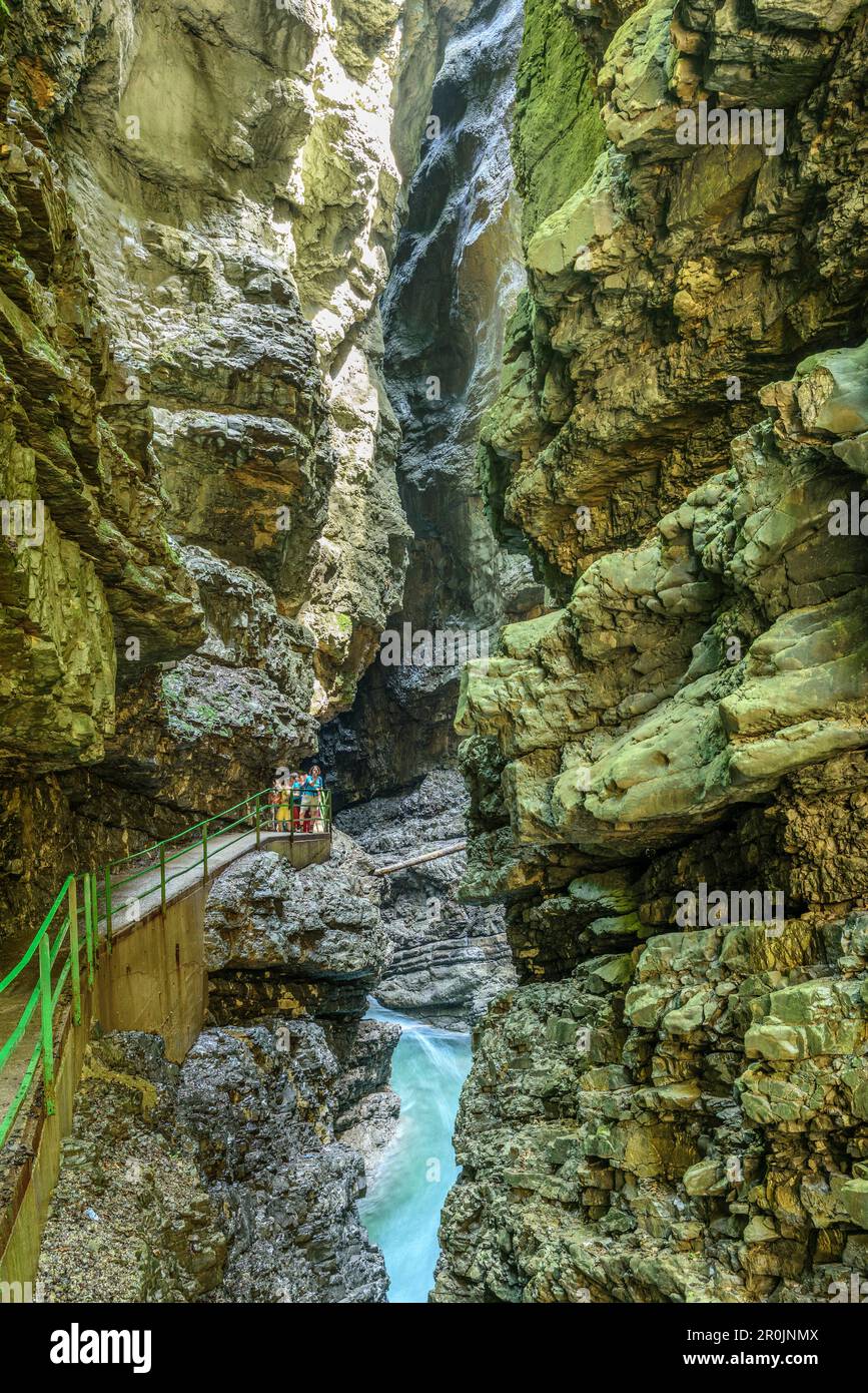 Several persons walking through canyon of Breitachklamm, Breitachklamm, Allgaeu Alps, Allgaeu, Svabia, Bavaria, Germany Stock Photo