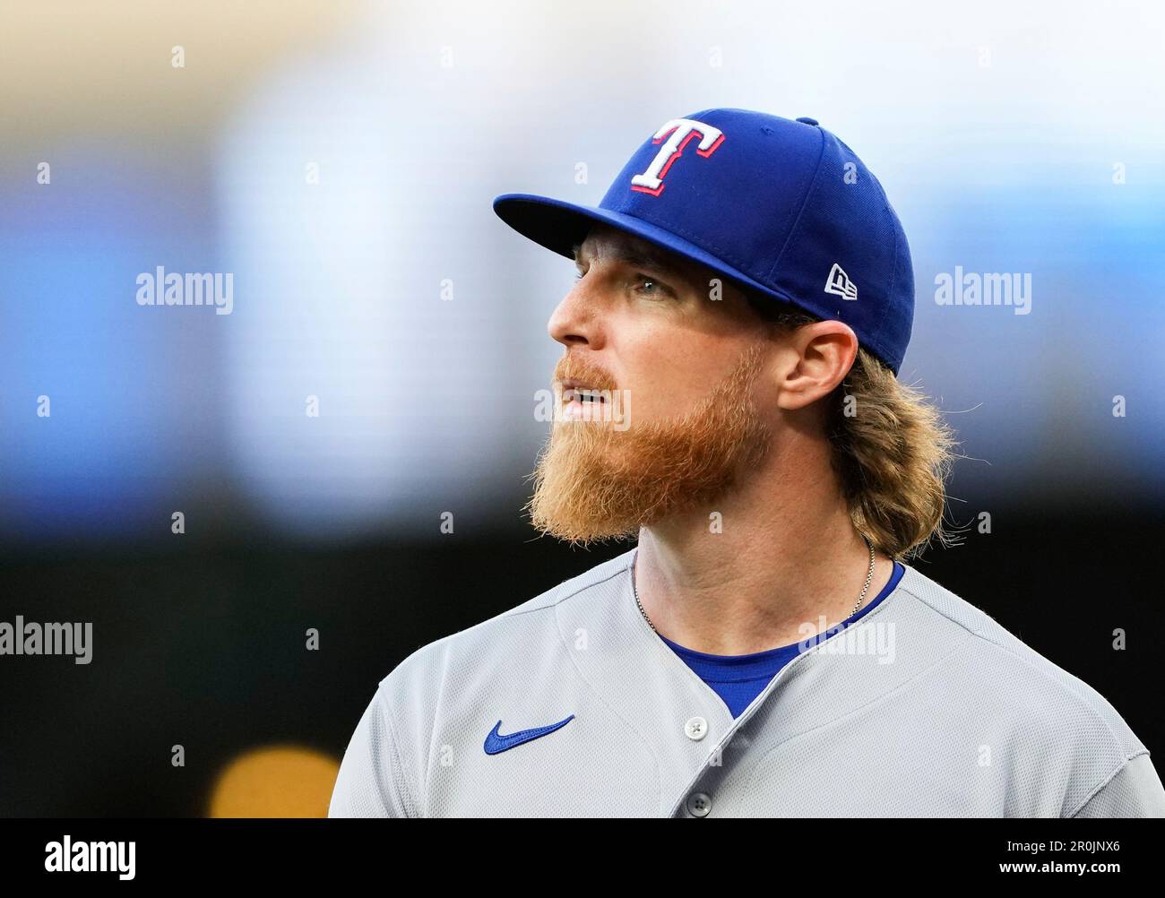 Texas Rangers starting pitcher Jon Gray walks off the field after