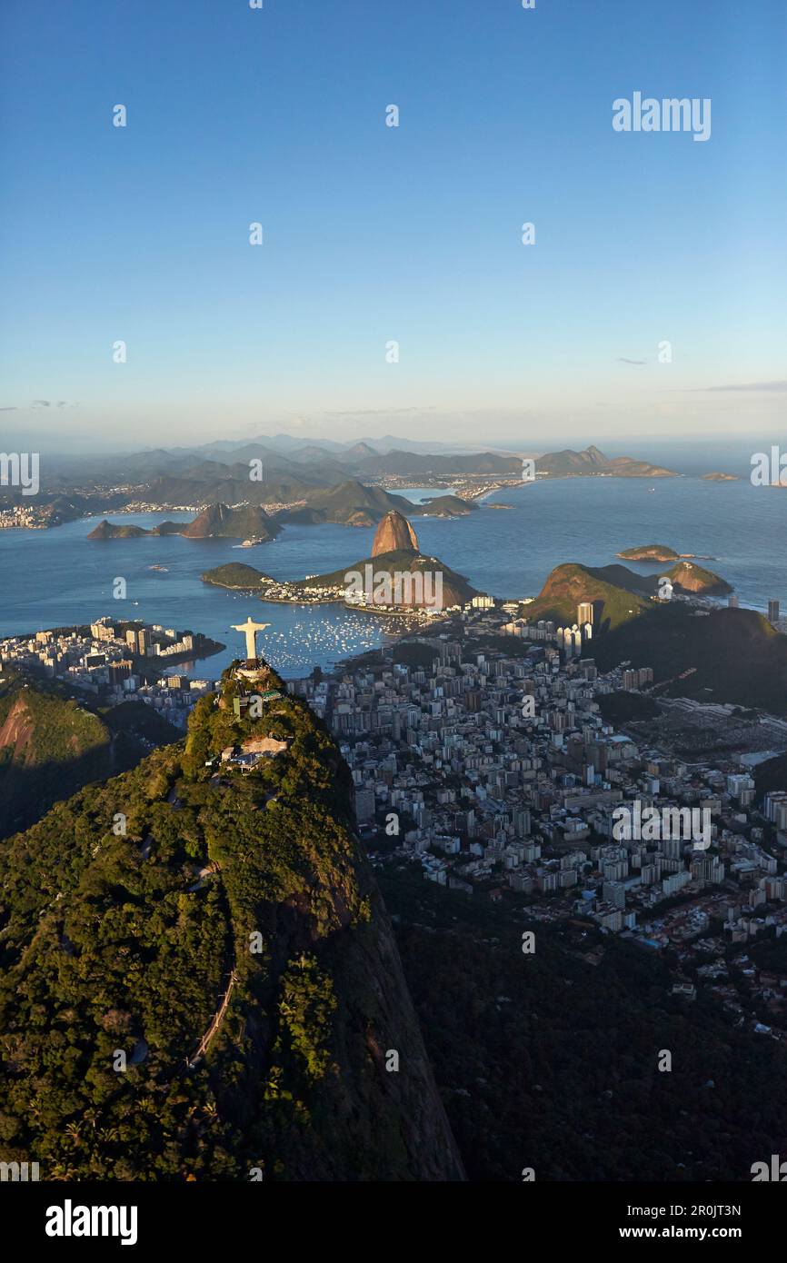 Cristo Redentor (Christ the Redeemer) statue on Corcovado Mountain, Tijuca Forest in the southern part of town, facing east over Baia de Guanabara, Su Stock Photo