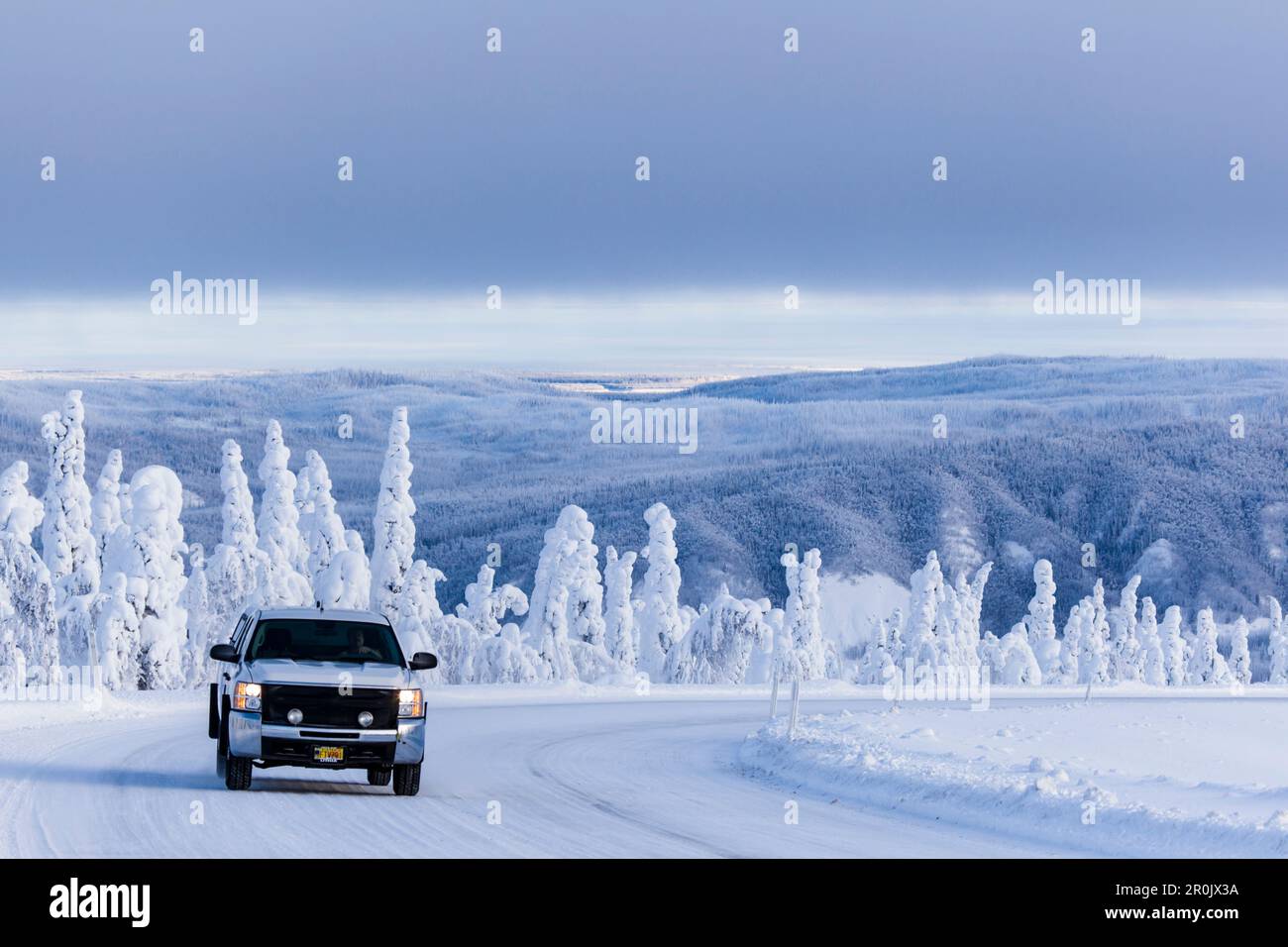Pickup Truck on the Dalton Highway in snow covered landscape, Yukon-Koyukuk Census Area, Alaska, USA Stock Photo