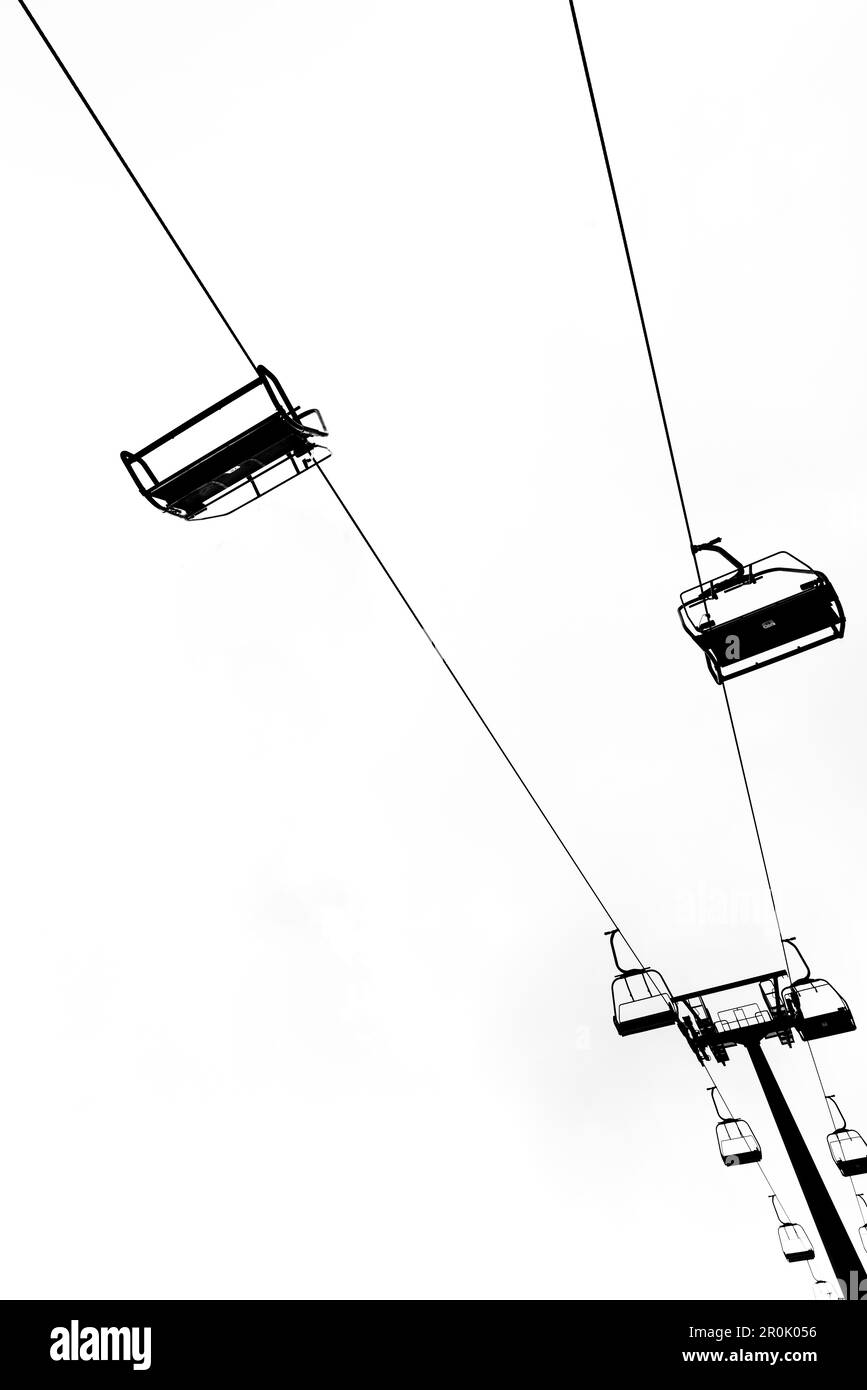 Silhouette of an inactive chairlift in the Alps without people, Merano, South Tirol, Alto Adige, Italy Stock Photo