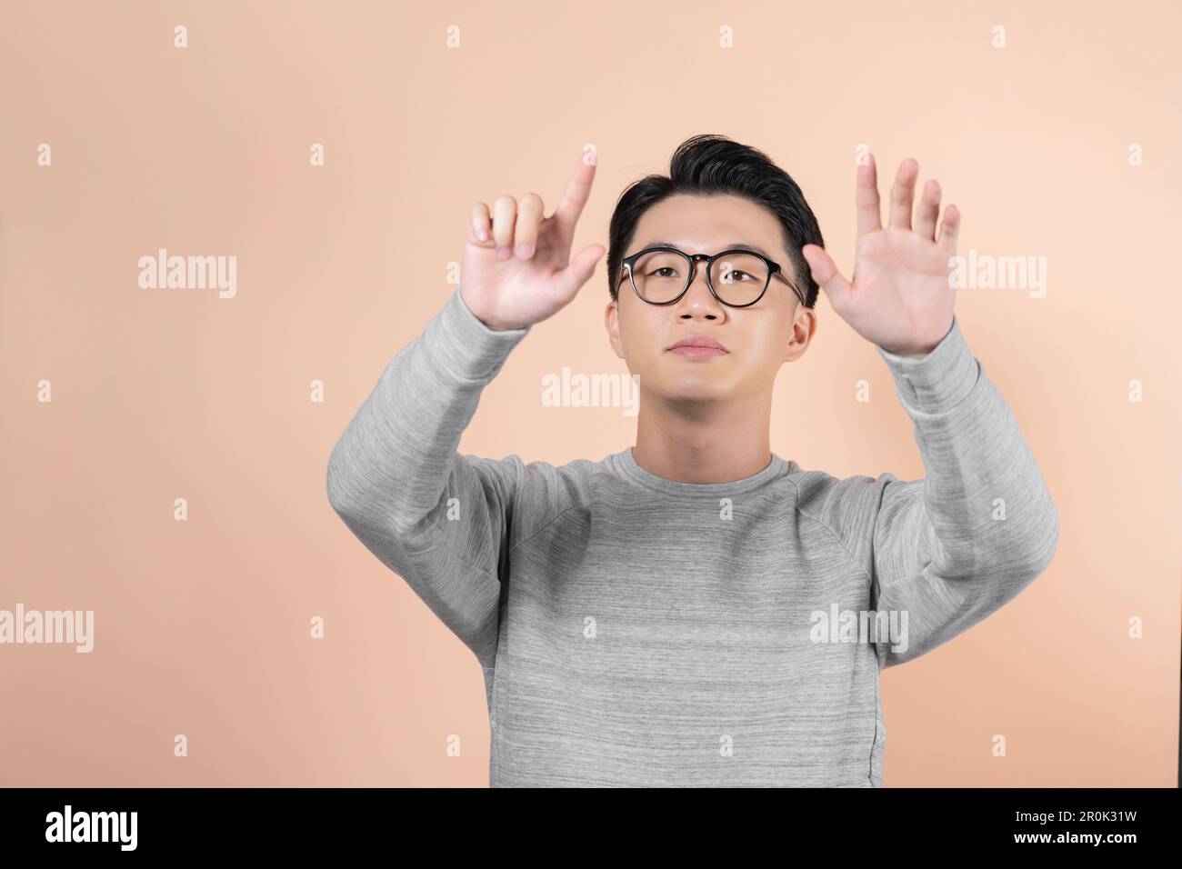Businessman pressing an imaginary button Stock Photo