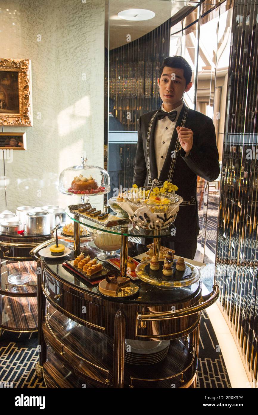 Waiter with dessert cart at Robuchon au Dome restaurant at Grand Lisboa