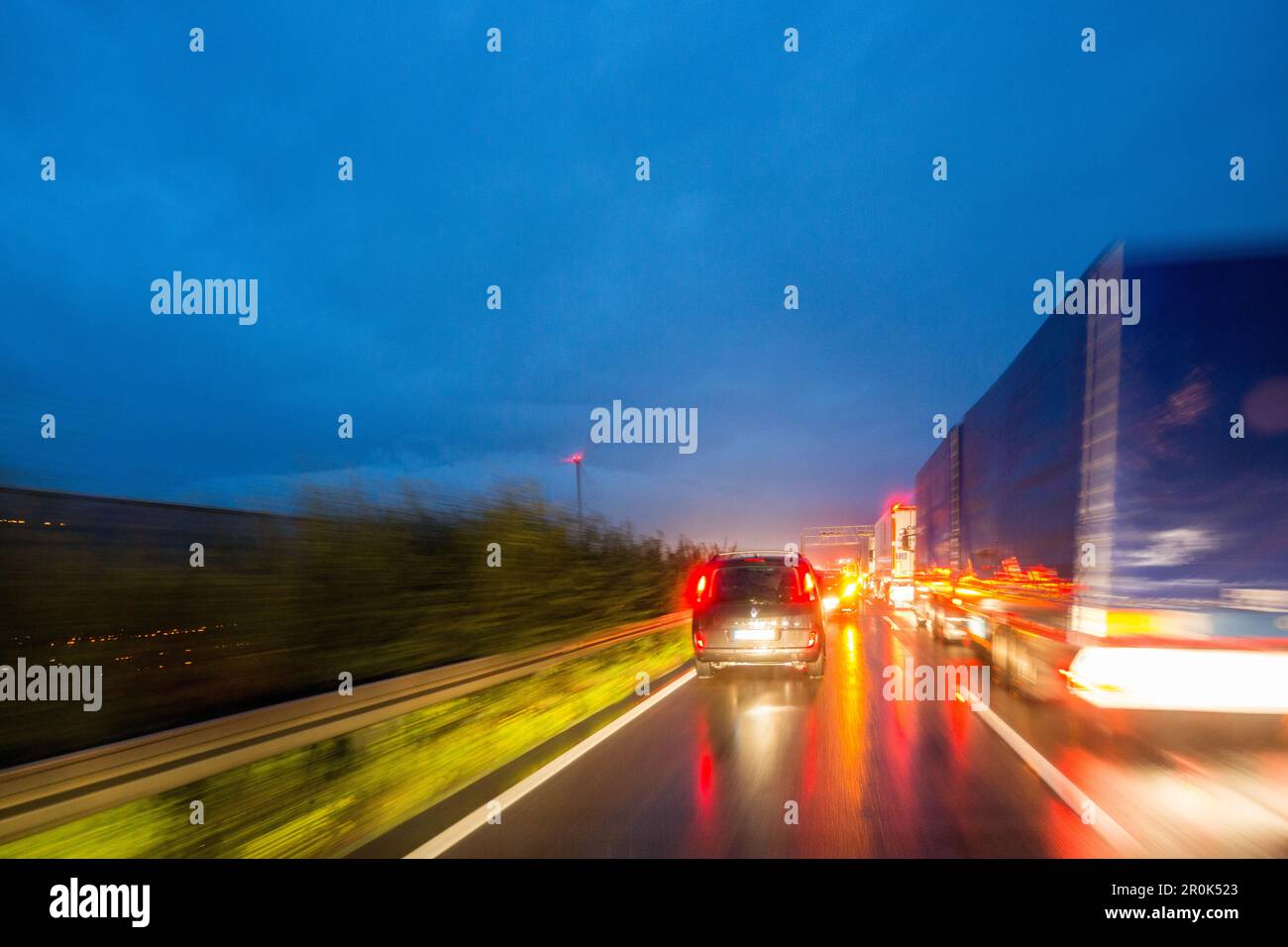 A1 German Autobahn, congestion, night, lights, trucks, tail lights