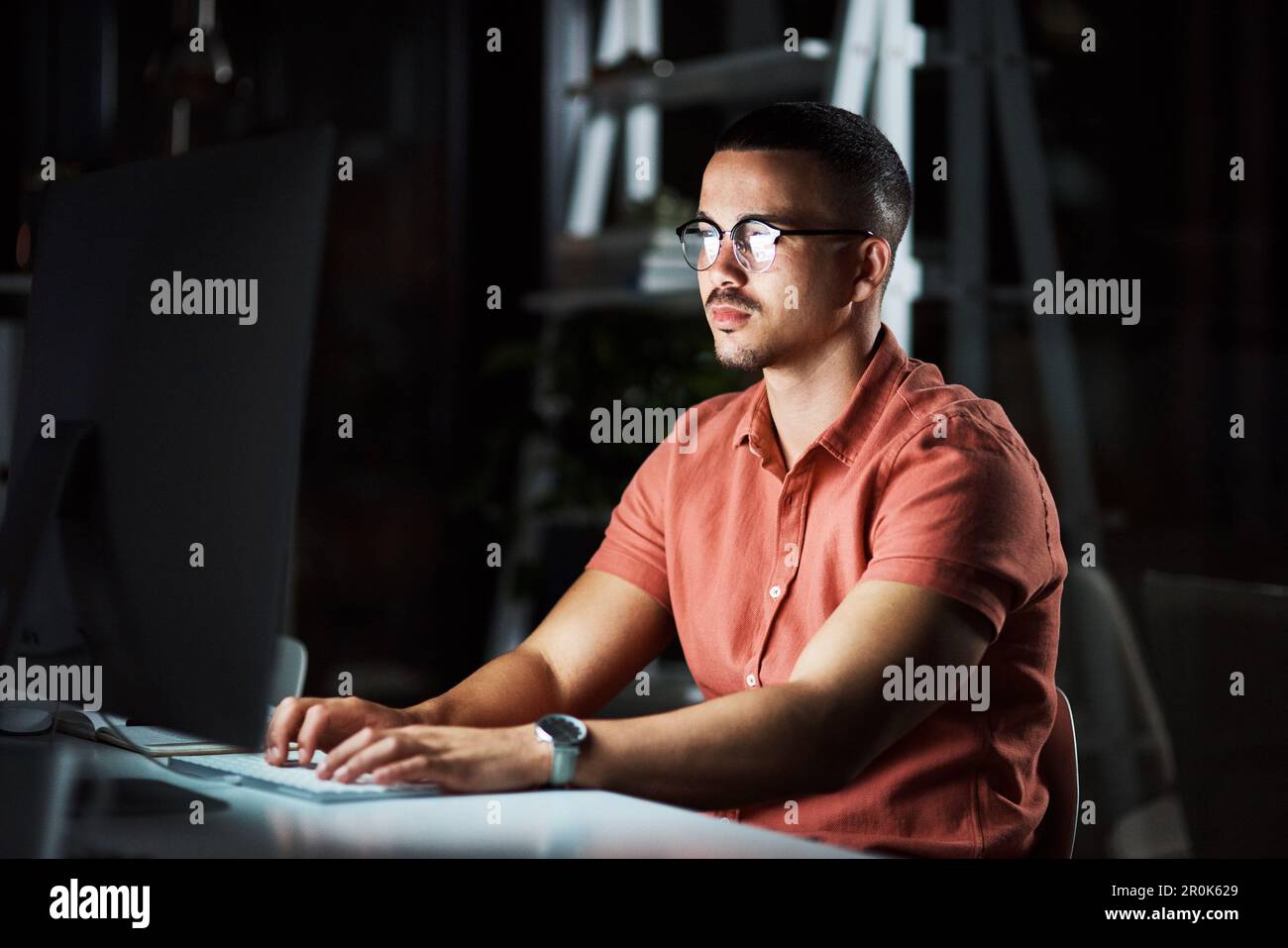 Its time to finish up. a business man using his computer while working ...