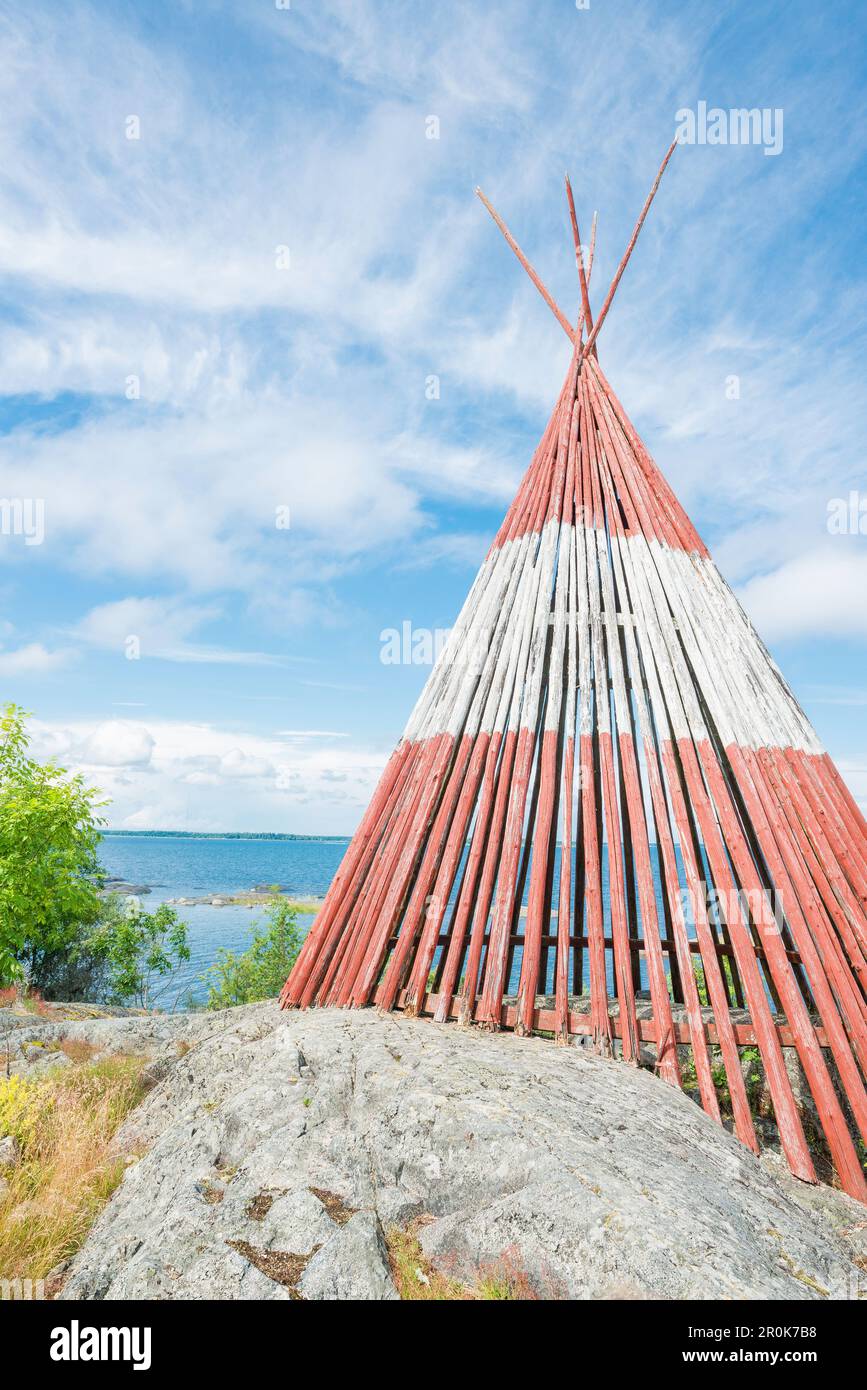 Red and white wooden tent standing on the rocks by the sea, Oregrund, Uppsala, Sweden Stock Photo