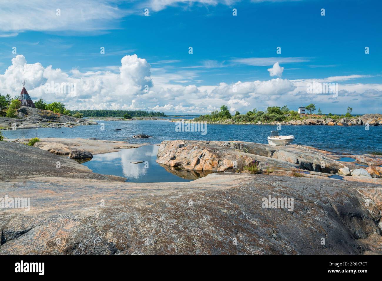 view into a bay with boat and cloudy summer sky, Oregrund, Bothnian sea, Uppsala, Sweden Stock Photo