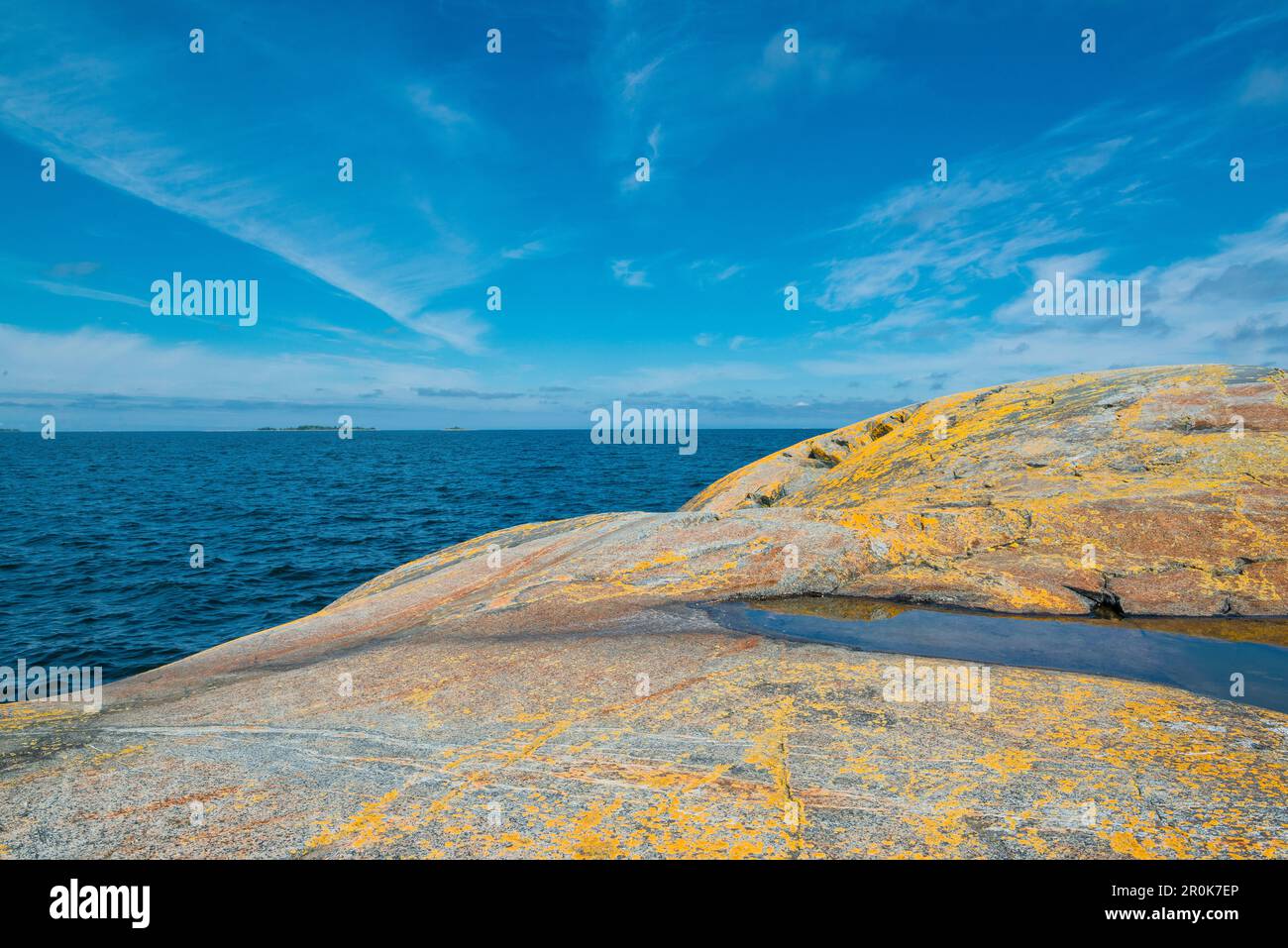 view over rocks with yellow moss to the sea, Oregrund, Bothnian sea, Uppsala, Sweden Stock Photo