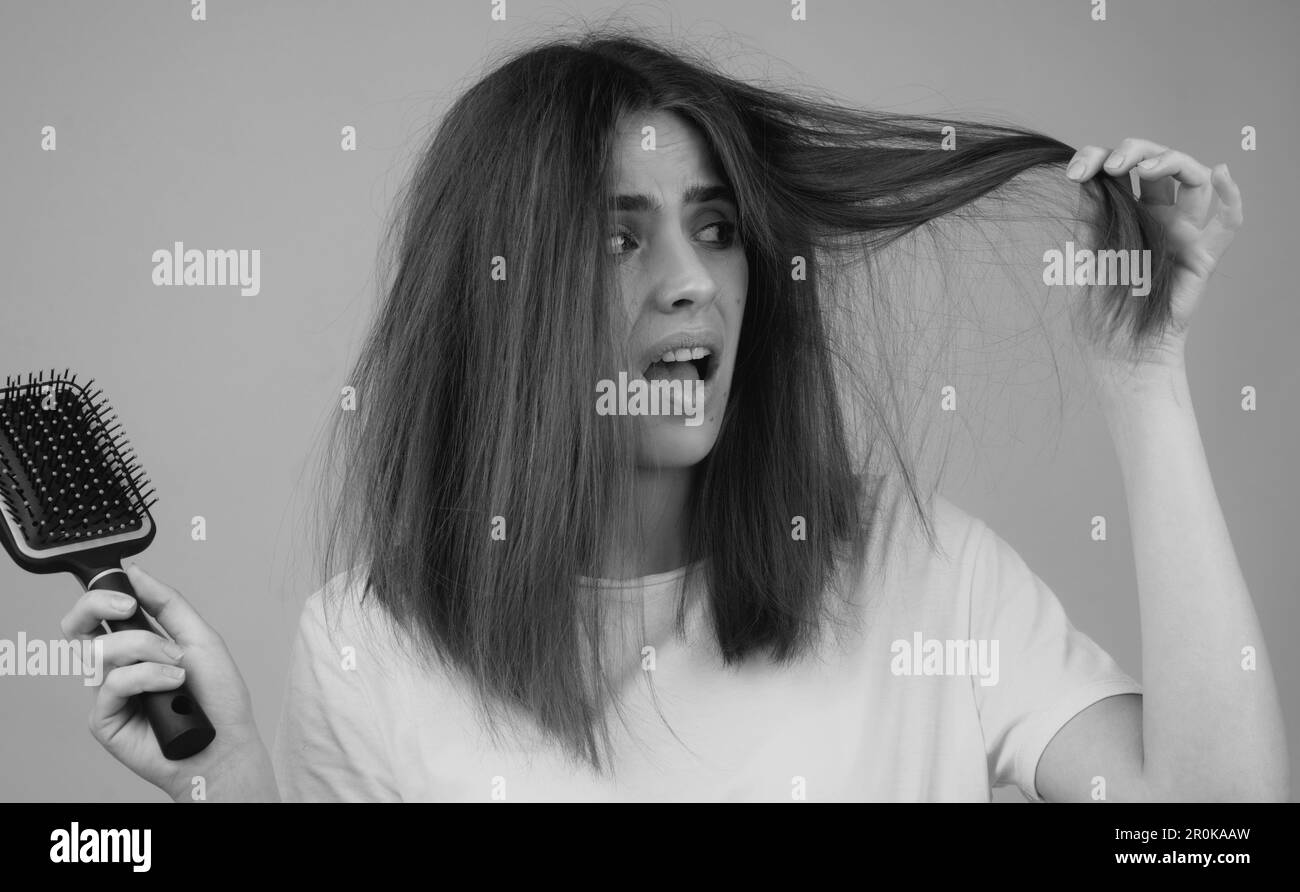 Hair loss woman with a comb and problem hair. Hairloss stressed woman