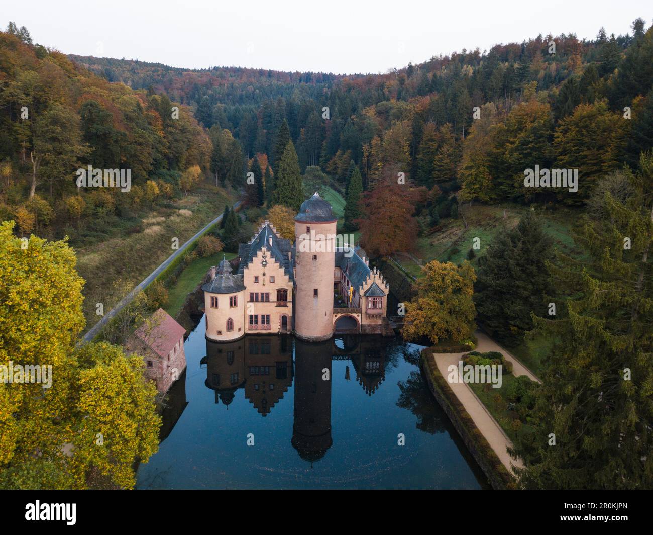 Aerial of Schloss Mespelbrunn castle with reflection in moat, Mespelbrunn, Räuberland, Spessart-Mainland, Bavaria, Germany Stock Photo
