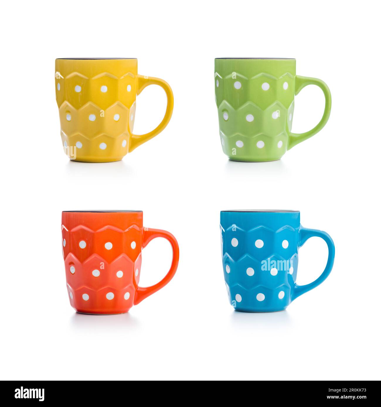The polka dot mugs isolated on the white background. Stock Photo