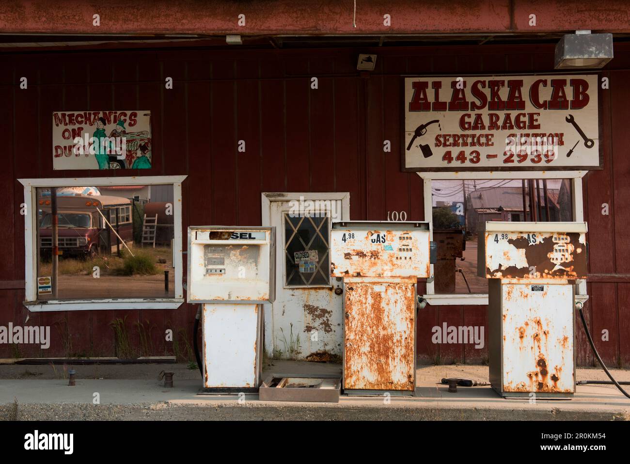A rusted rundown looking gas station with Mechanics on Duty and Closed sign, Nome, southern