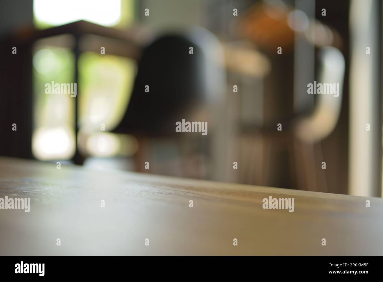 Wood table top on blur restaurant or cafe interior background. Stock Photo