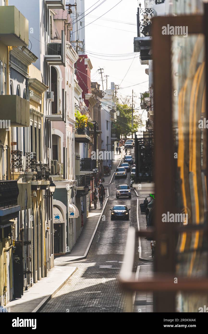 VIew of vibrant narrow street in Old San Juan Puerto Rico from balcony ...