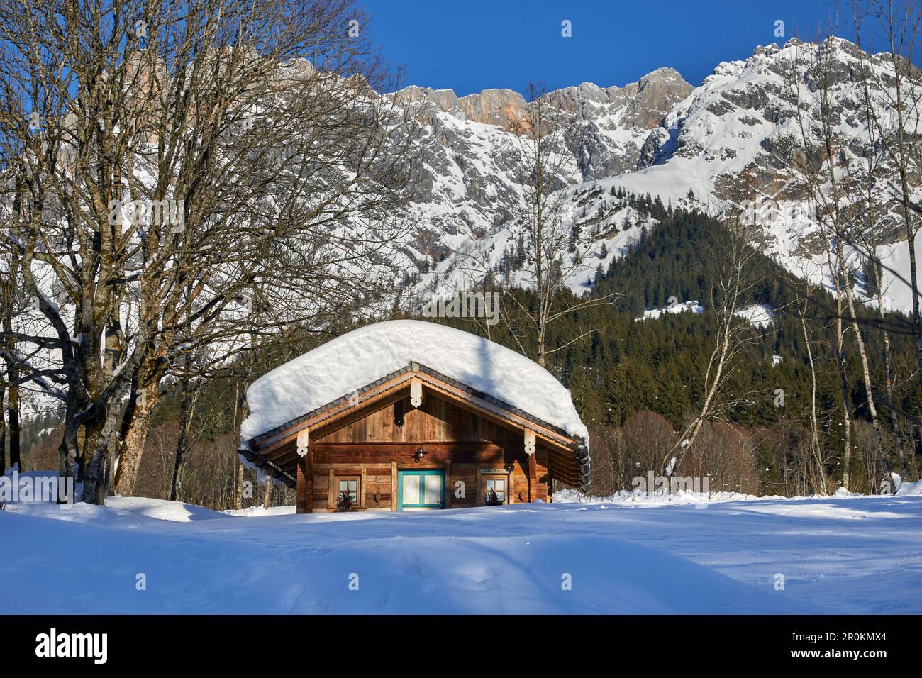 snow-covered mountain hut in Hinterthal, municipality of Maria Alm, Salzburg, Austria Stock Photo