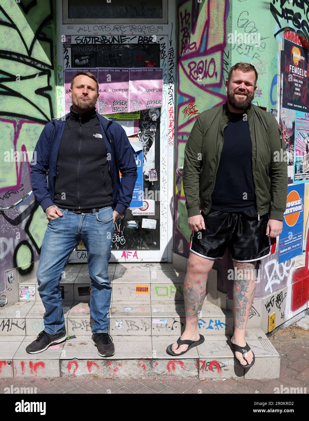 Rostock, Germany. 26th Apr, 2023. Olaf Ney (l-r), drummer, and Jan Monchi  Gorkow, singer and frontman of the band Feine Sahne Fischfilet, in the  Kröpeliner Tor suburb KTV. The bands new album 
