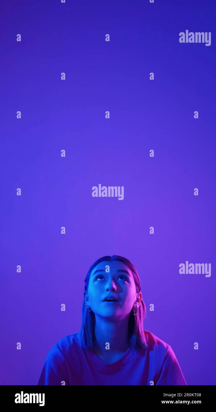 Color light portrait amazed girl surprised woman Stock Photo - Alamy