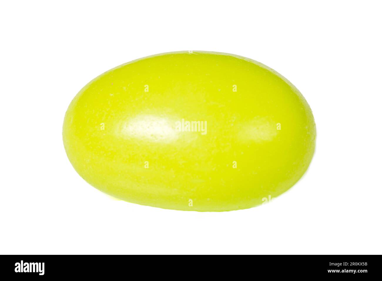 Almond Candies. Chocolate covered yellow dragee candy isolated on white