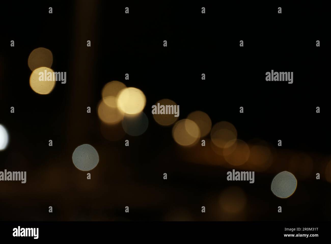 Blurred view of city with street lights at night. Bokeh effect Stock ...