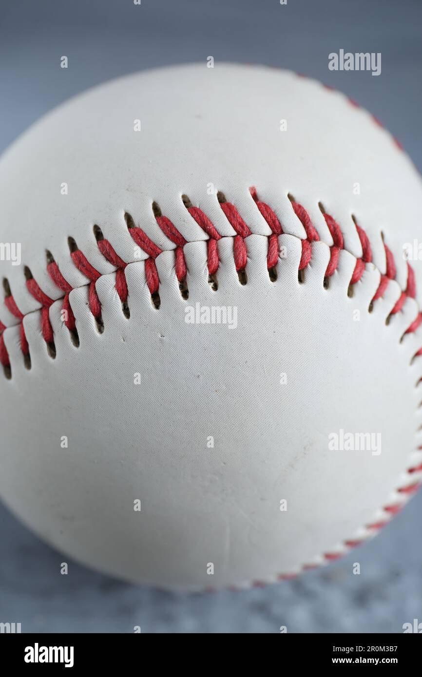 Close up of a white baseball ball in multi-colored red smoke from a vape on  a black isolated background Stock Photo - Alamy