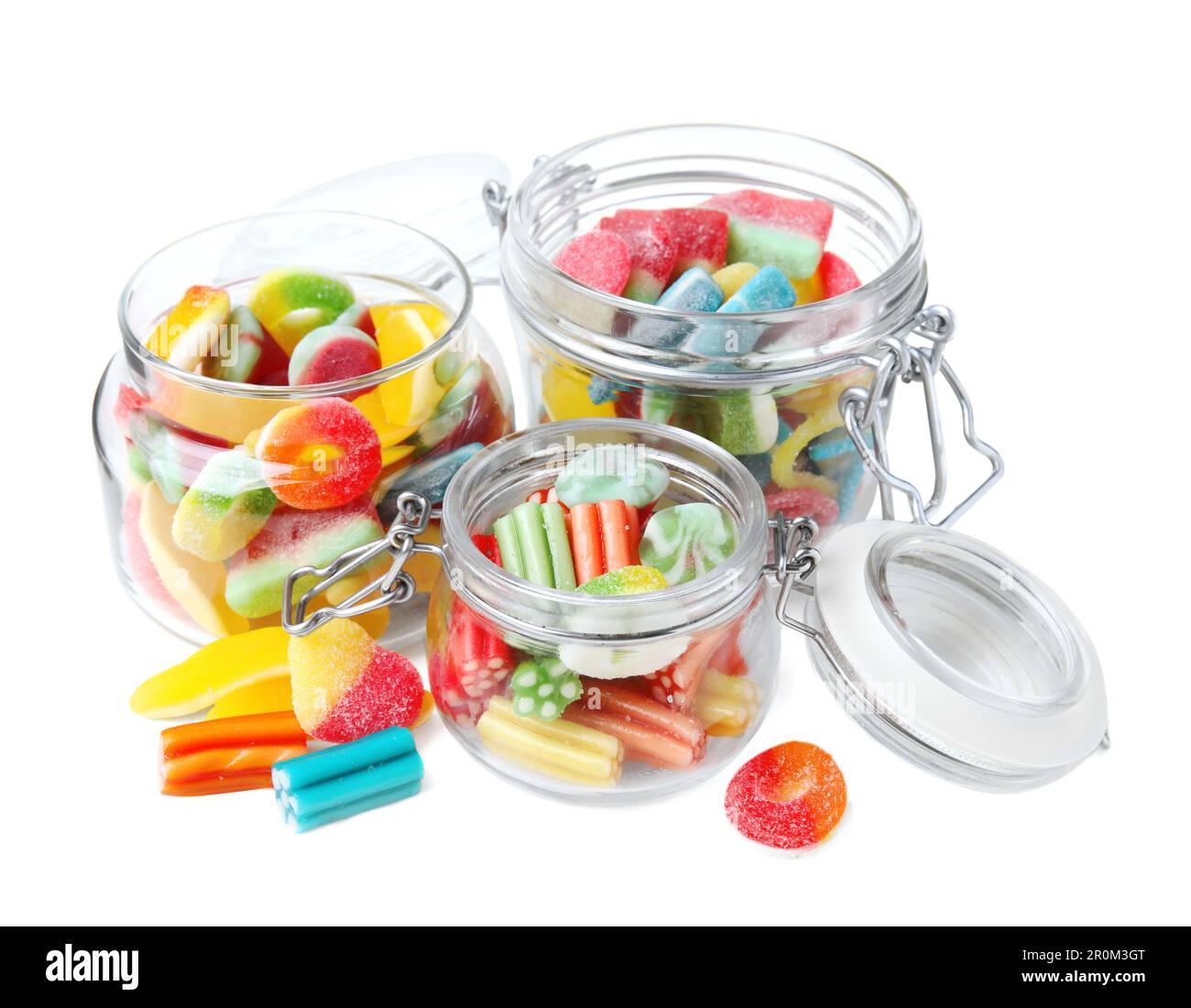 Tasty jelly candies in jars on white background Stock Photo - Alamy