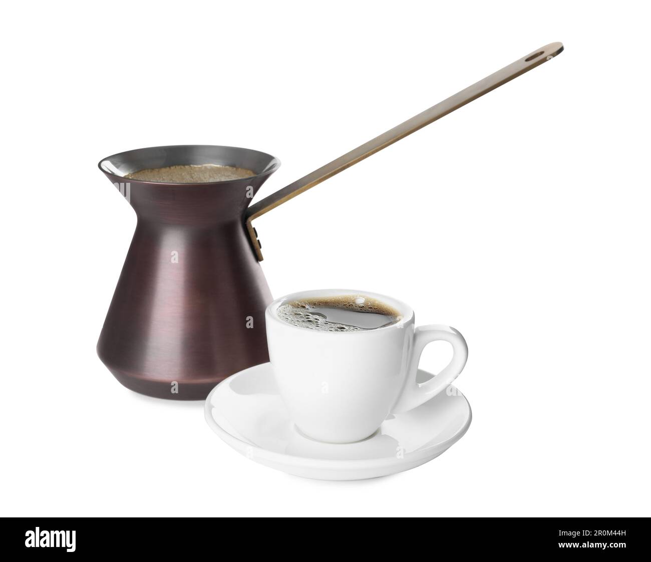 Metal turkish coffee pot and cup of hot drink on white background Stock Photo Alamy