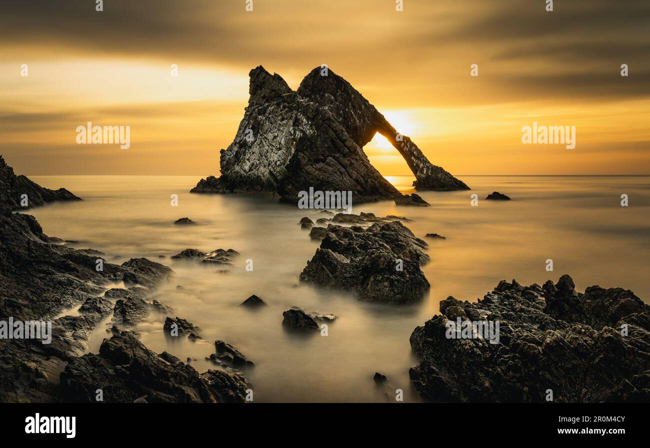 Bow Fiddle Rock long exposure sunrise, Portknockie, Moray, East Coast, Scotland, Great Britain, United Kingdom Stock Photo