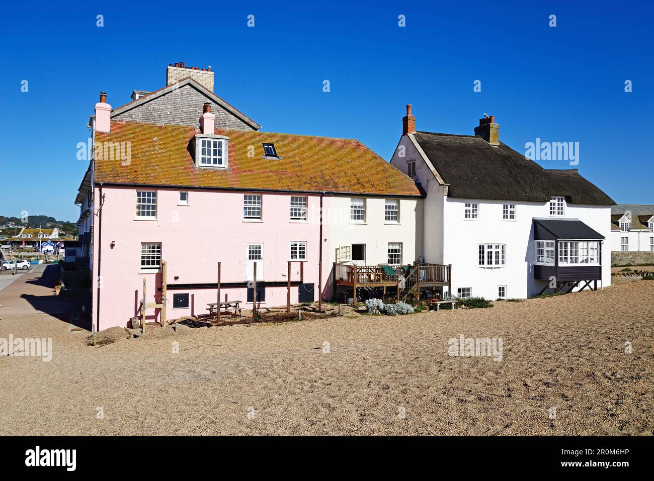 View of pretty painted beachside cottages, West Bay, Dorset, UK, Europe. Stock Photo