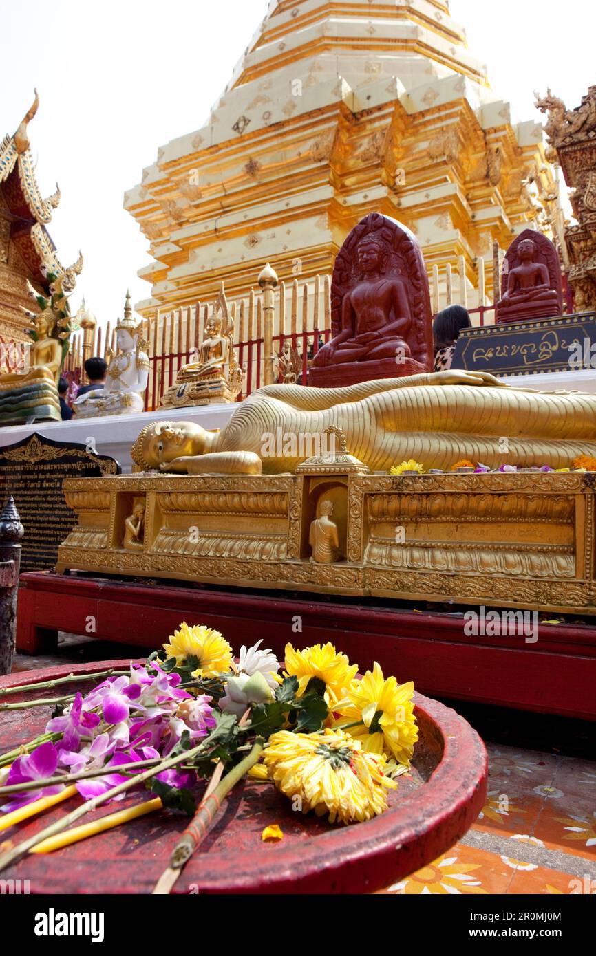 Offerings and Buddha statues in the golden Buddhist temple. Wat Prah
