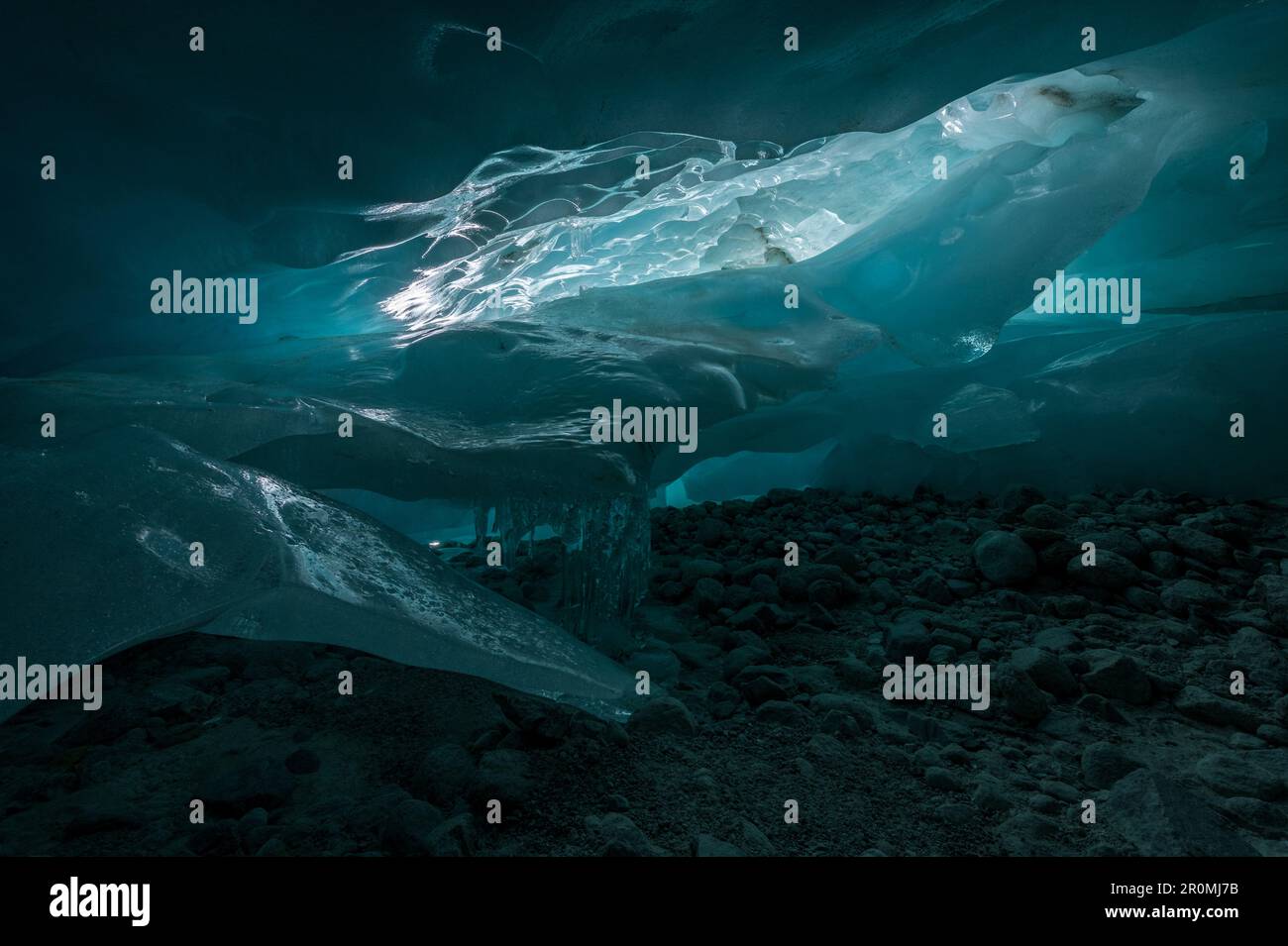 magical blue ice structures in a glacier cave in the Swiss Alps Stock Photo