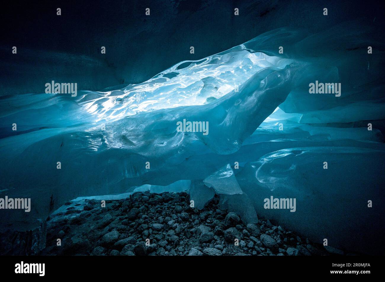 magical blue ice structures in a glacier cave in the Swiss Alps Stock Photo