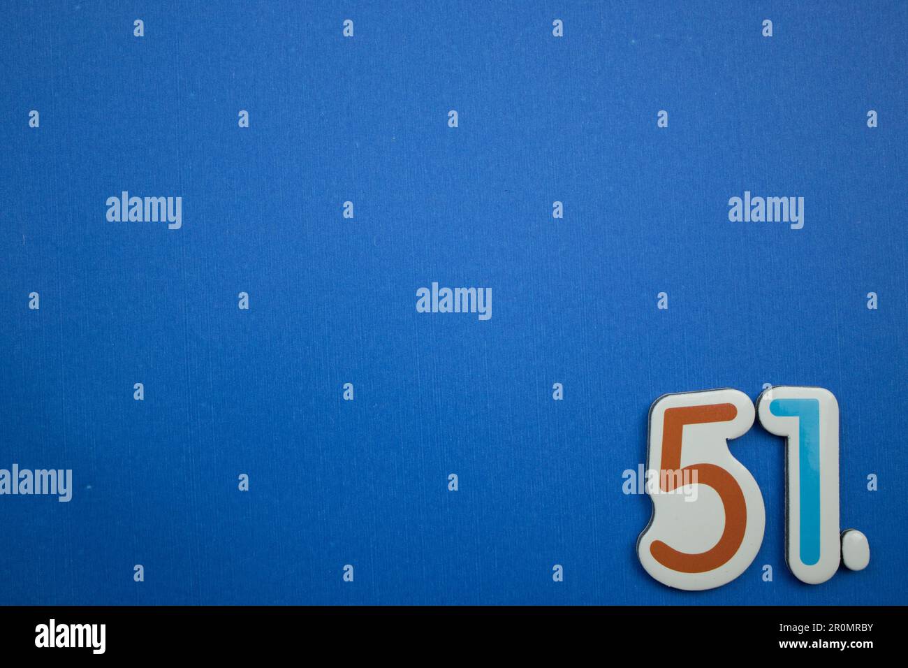 The number 51, orange and light blue, photographed from above, placed