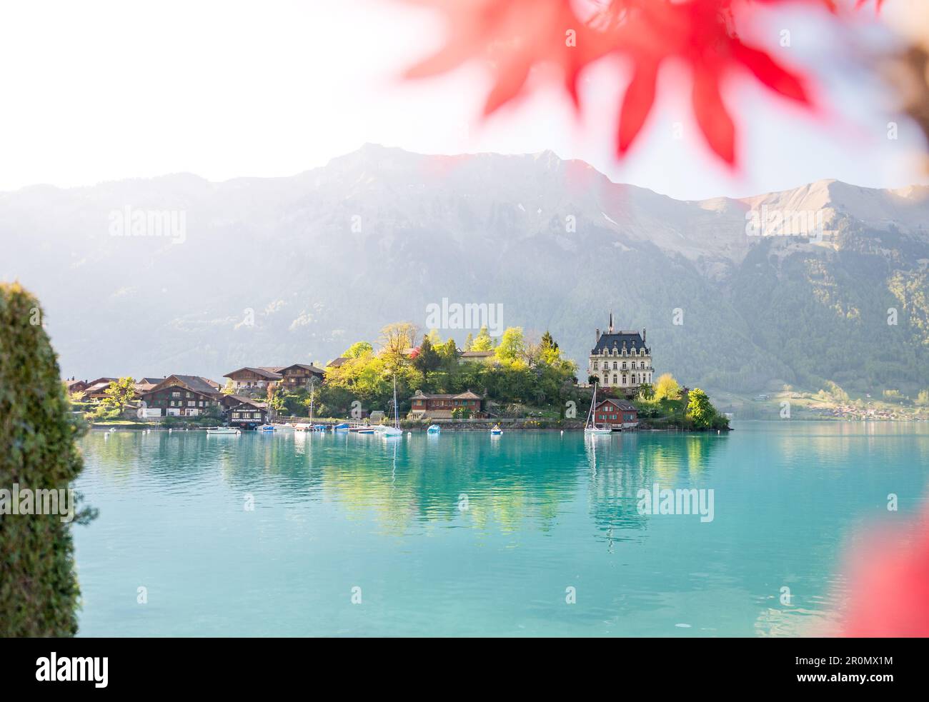 view of Schloss Seeburg, Iseltwald in turquoise Lake Brienz Stock Photo