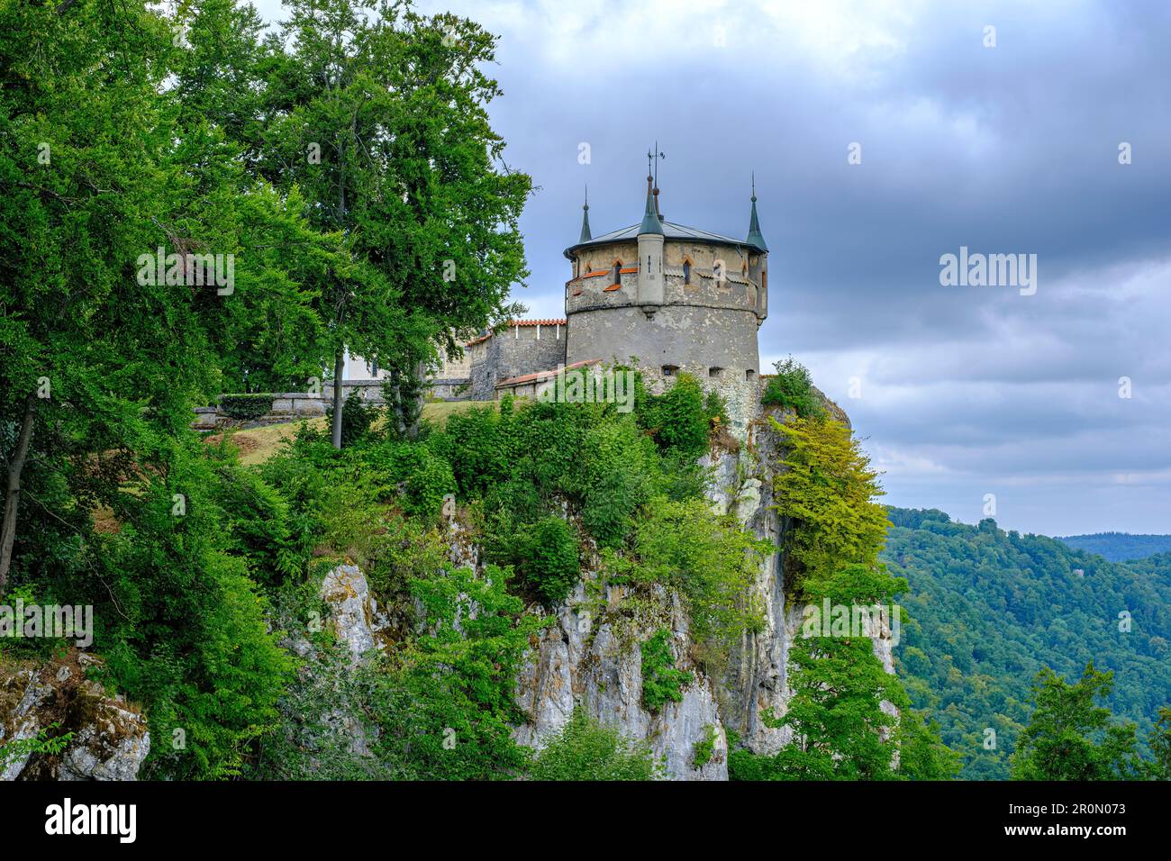 Remote view of Lichtenstein Castle, a Historicist edifice in neo-Gothic style, overlooking the settlement of Honau, Baden-Wurttemberg, Germany. Stock Photo