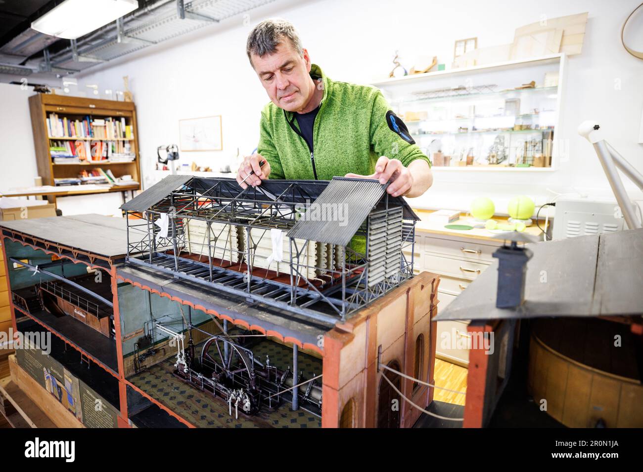 Munich, Germany. 09th May, 2023. Claus Grünewald, model maker, works on ...