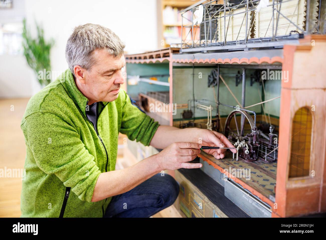 Munich, Germany. 09th May, 2023. Claus Grünewald, model maker, works on ...