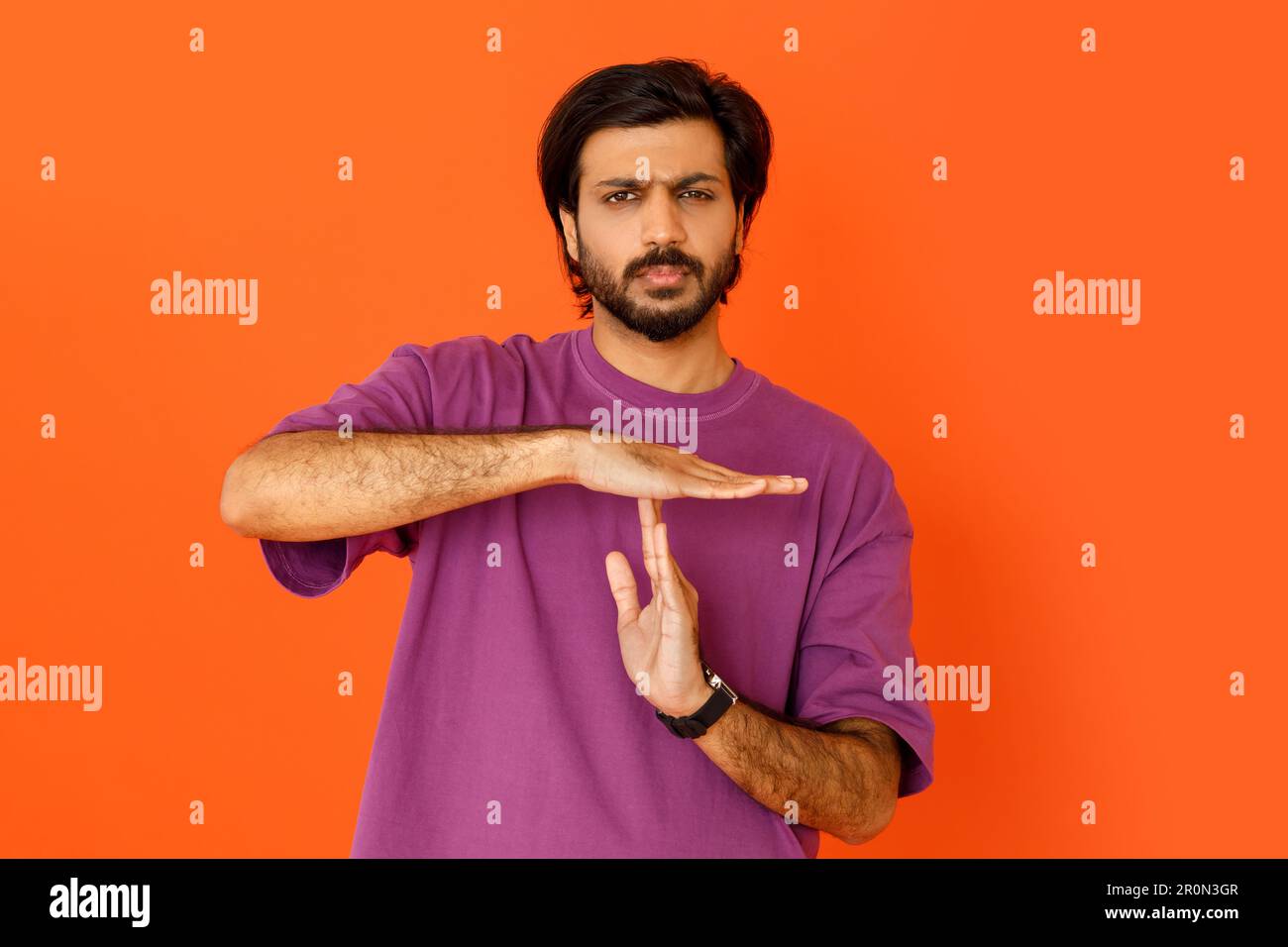 Serious tired indian man showing timeout symbol with hands Stock Photo