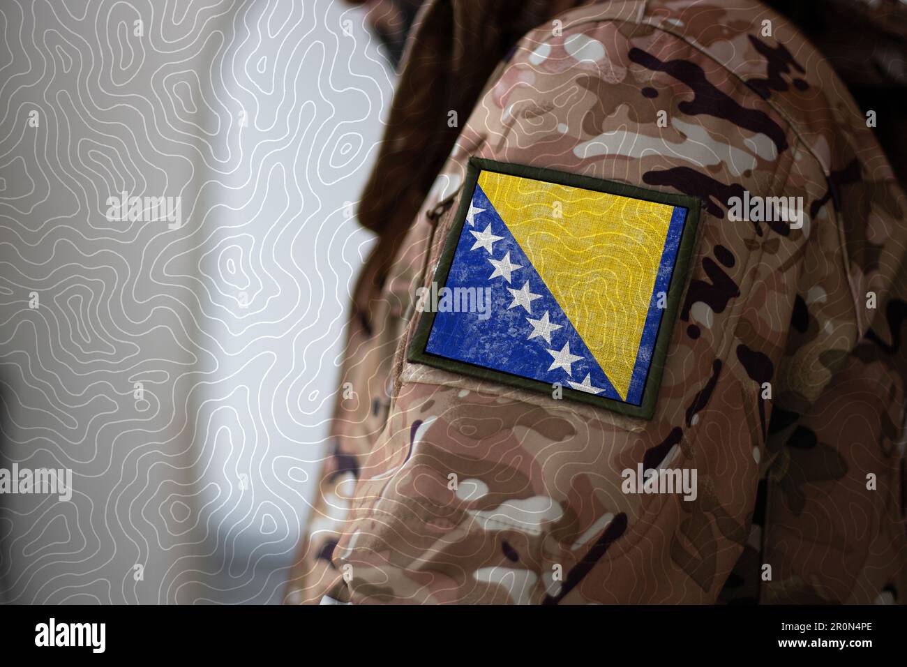 Bosnia and Herzegovina Soldier. Soldier with flag Bosnia and Herzegovina, Bosnia and Herzegovina flag on a military uniform. Camouflage clothing Stock Photo