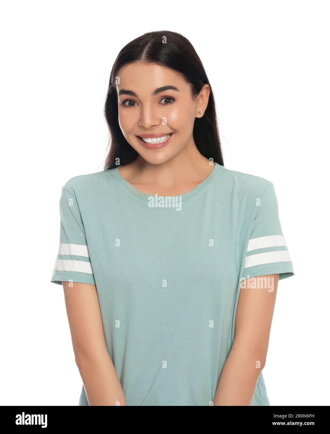 Embarrassed young woman in shirt on white background Stock Photo - Alamy
